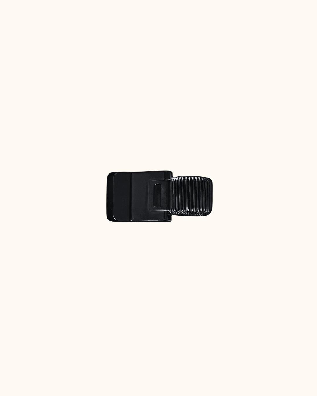 Kuura Minimalist Pen Loop in black, a slim metal clip that holds a pen on the cover. Minimalist pen holder for journal and notebook covers