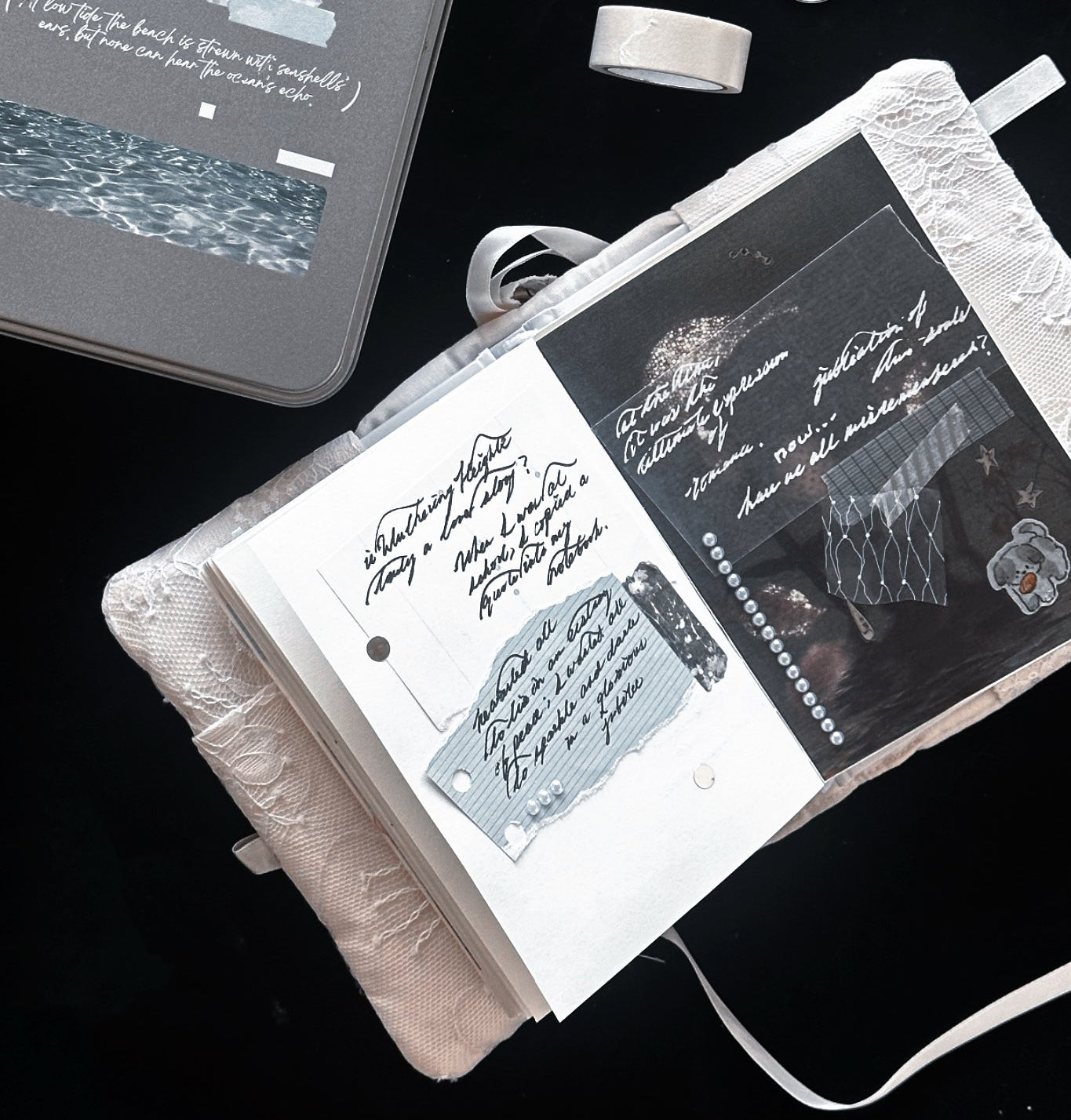 Open notebook with handwritten text and decorative elements on a dark background