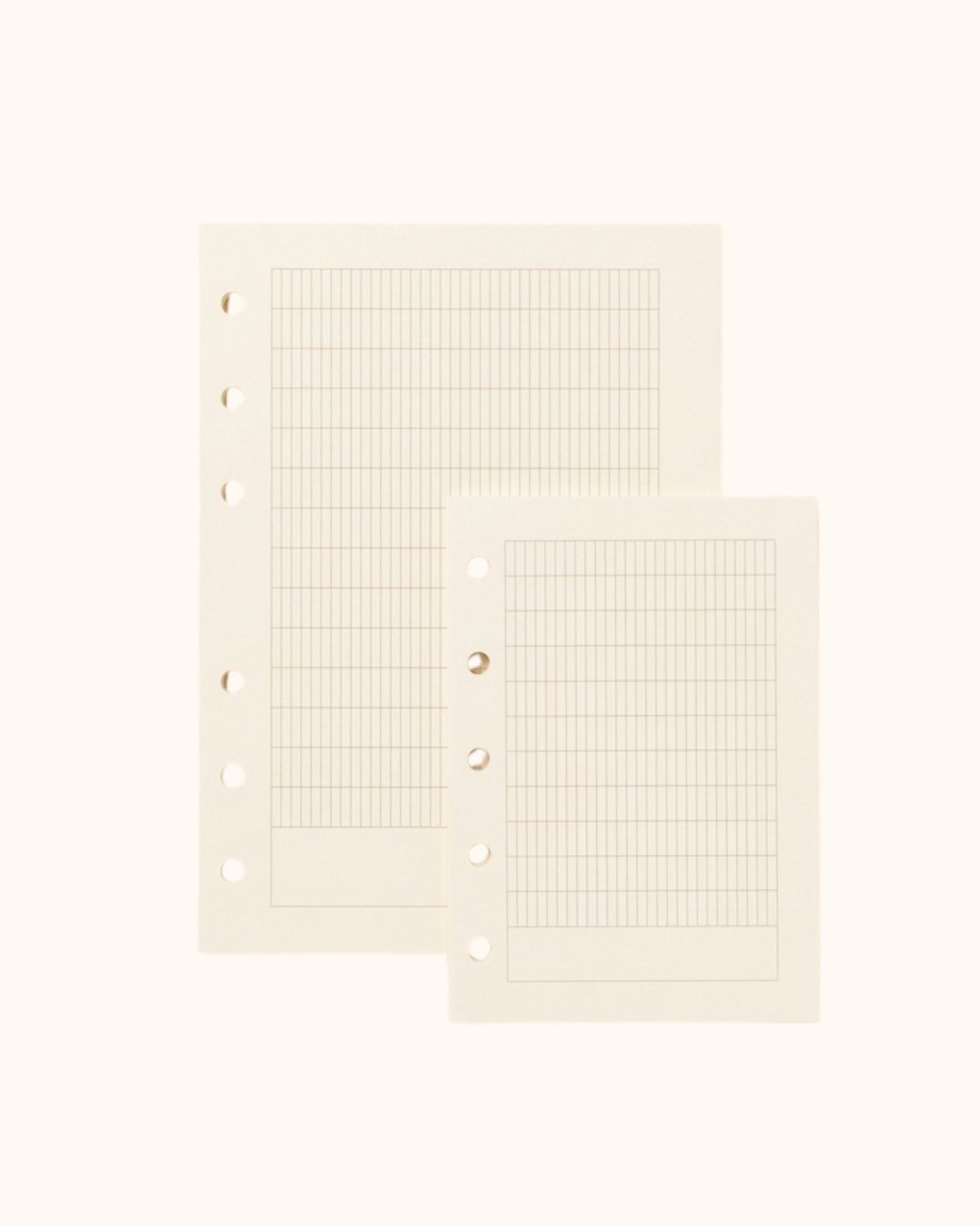 Overhead view of two Kuura premium French ruled (Seyes) journal refill sheets in A6 and A7 sizes. Showcasing the structured grid pattern with standard 5-hole and 6-hole punching, ideal for practicing elegant handwriting and calligraphy.