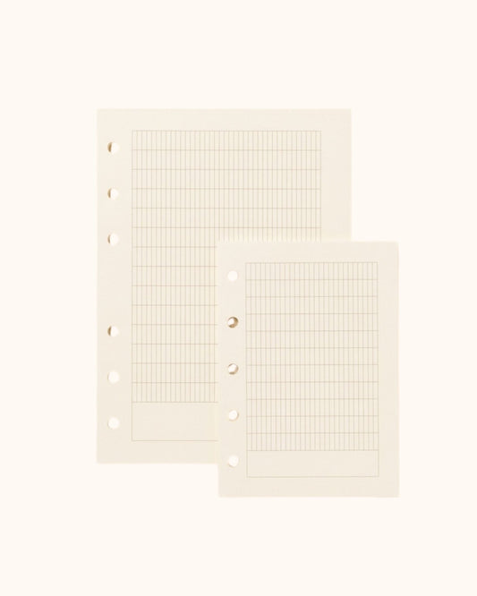 Overhead view of two Kuura premium French ruled (Seyes) journal refill sheets in A6 and A7 sizes. Showcasing the structured grid pattern with standard 5-hole and 6-hole punching, ideal for practicing elegant handwriting and calligraphy.