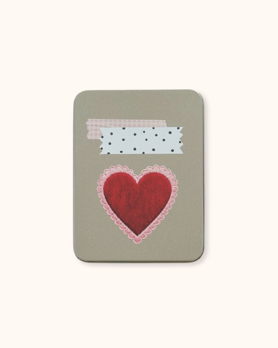A large aesthetic tin box in silver, showcasing a Coquette red heart and retrograde washi tape collage on a minimalist textured surface. A functional and cute solution for deep desk organization.
