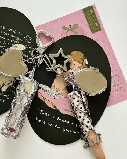 Kuura Macrame Journal Charm with Mirror, Heart and Star styles with silver net pouches and compact mirrors on illustrated journal cards. Y2K accessory
