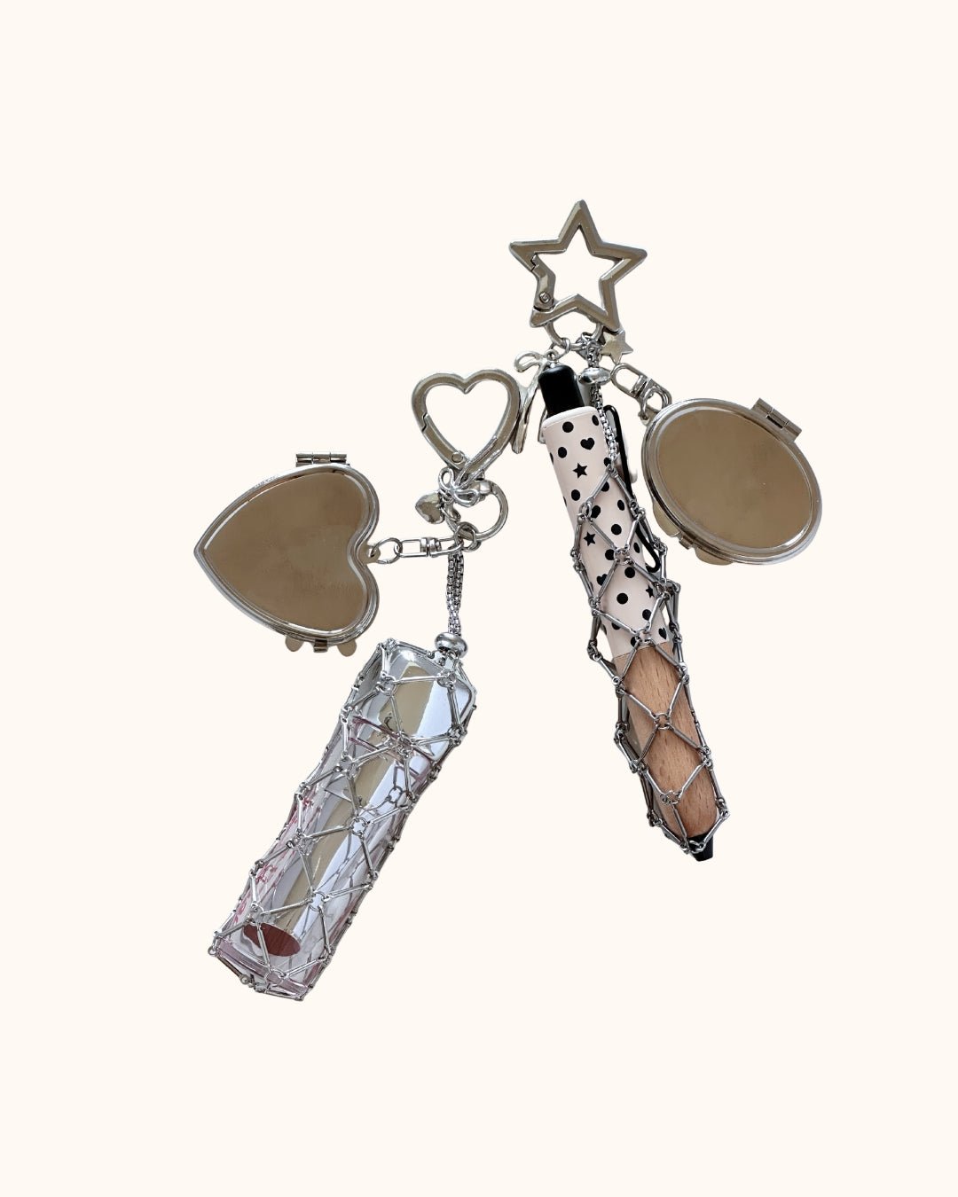 Kuura Macrame Journal Charm with Mirror in Heart and Star, silver metal net pouches with compact mirrors on a cream background. Cute journal bag charm