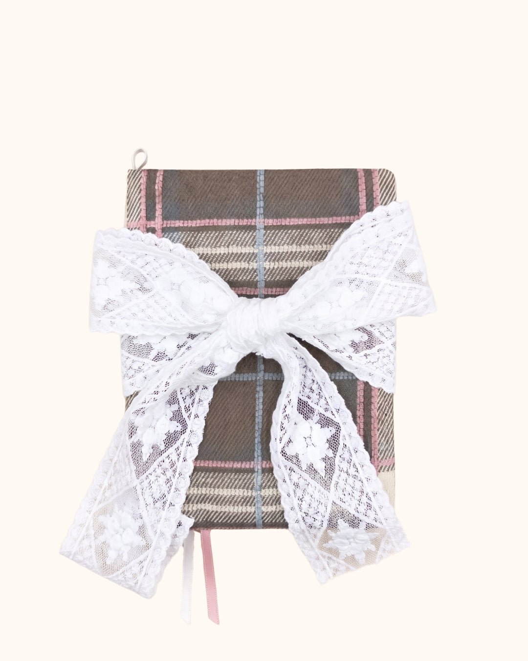 Kuura Museum Date A5 & A6 Journal & Notebook Cover in Brown Plaid, tied with an oversized ivory lace bow over the pink check. Coquette academia notebook