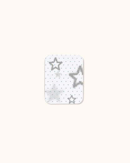 A small aesthetic trinket tin box in matte white, decorated with delicate gray and light blue starlight patterns. Ideal for creating a custom cute altoids wallet or keeping daily journaling supplies.