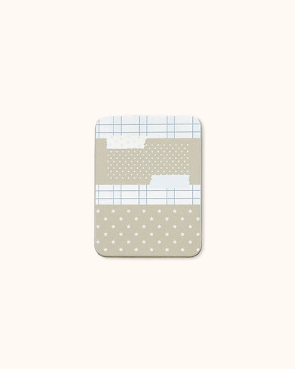 A medium aesthetic tin box in silver with a delicate beige star and grid collage design.