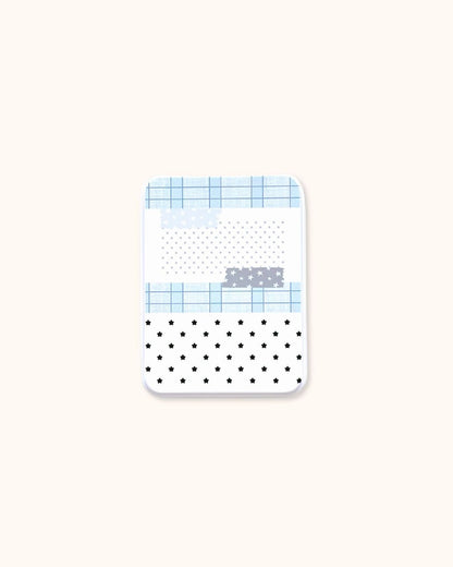 A medium aesthetic trinket tin box in matte white, decorated with a blue grid and star collage pattern.