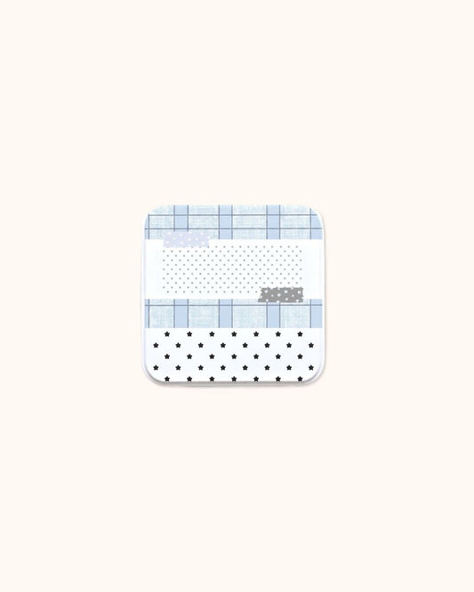A cute square aesthetic trinket tin box in matte white, featuring a design of stars, grid lines, and polka dots.
