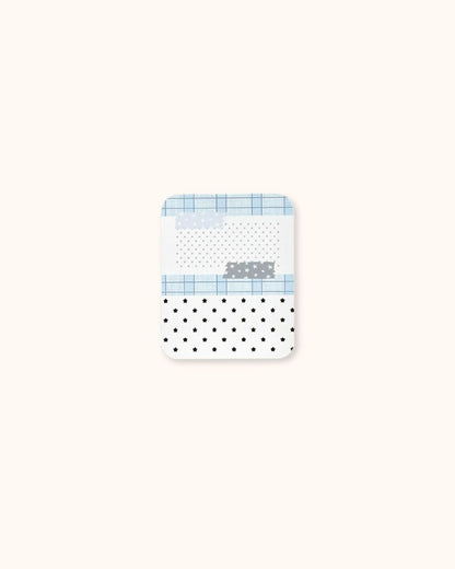 A small aesthetic trinket tin box in matte white, decorated with a blue grid and star collage pattern.