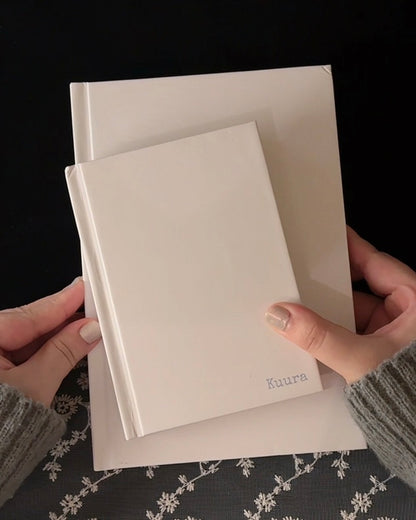 A5 & A6 unlined hardcover notebook shown up close, with pages turned and written on with various pens — Kuura aesthetic journaling supplies