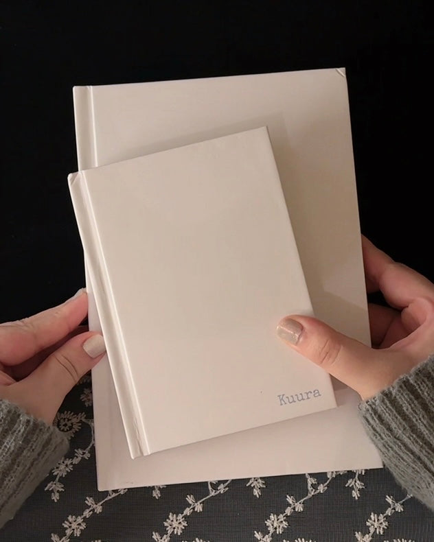 A5 & A6 unlined hardcover notebook shown up close, with pages turned and written on with various pens — Kuura aesthetic journaling supplies