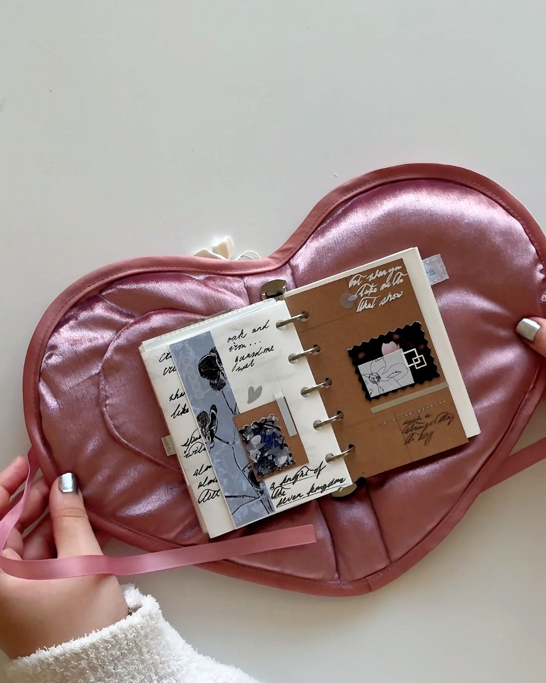 secret-teatime-handmade-pink-journal-showcase-video. Video showcasing hands holding the open pink heart-shaped the Secret Teatime A7 Journal Cover with ring binder, demonstrating aesthetic journaling spread layouts and how it perfectly holds everyday memories.