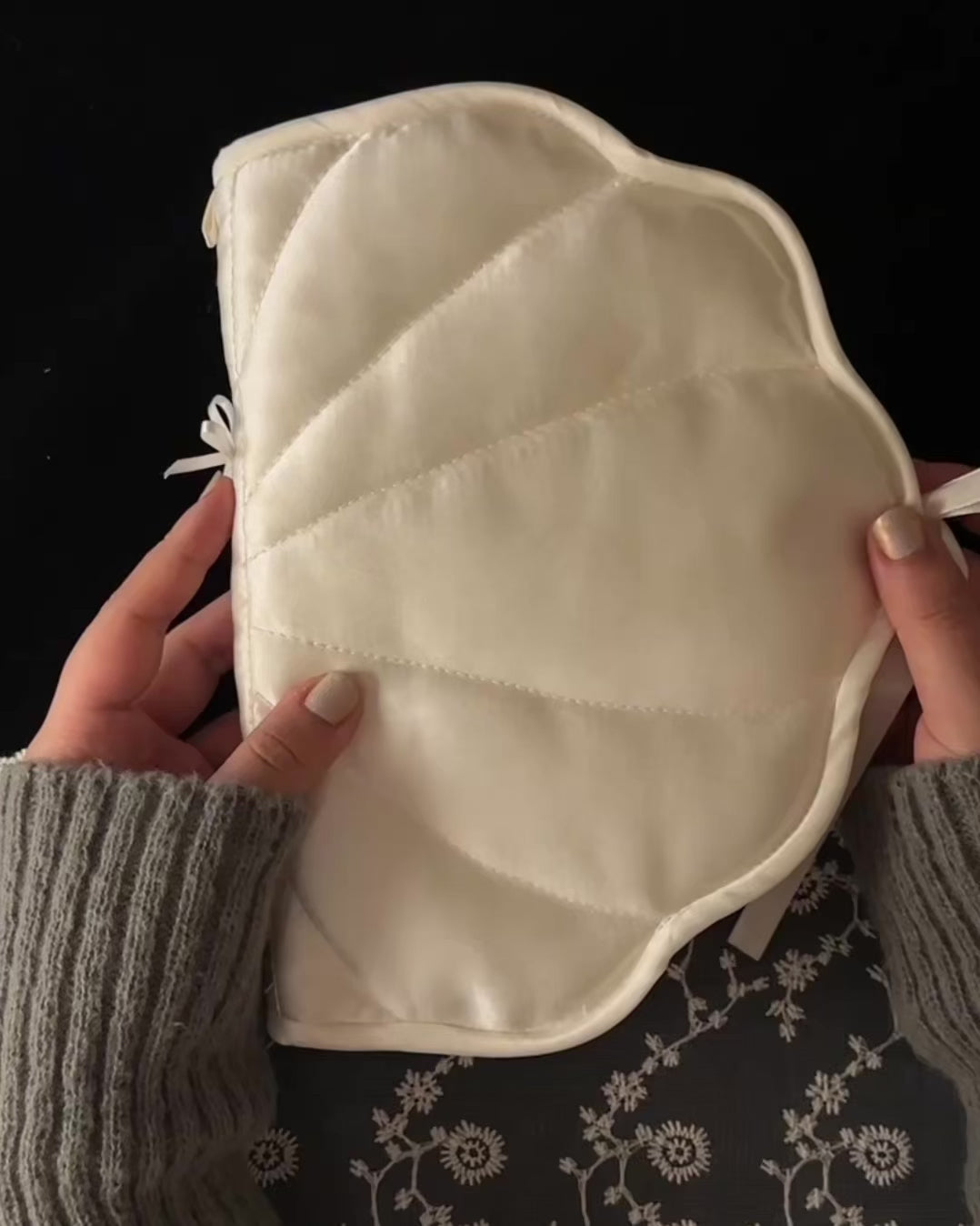 Shell-shaped satin journal cover shown with its charm loop and bow untied, then opened to reveal the 6-ring binder filled with pages