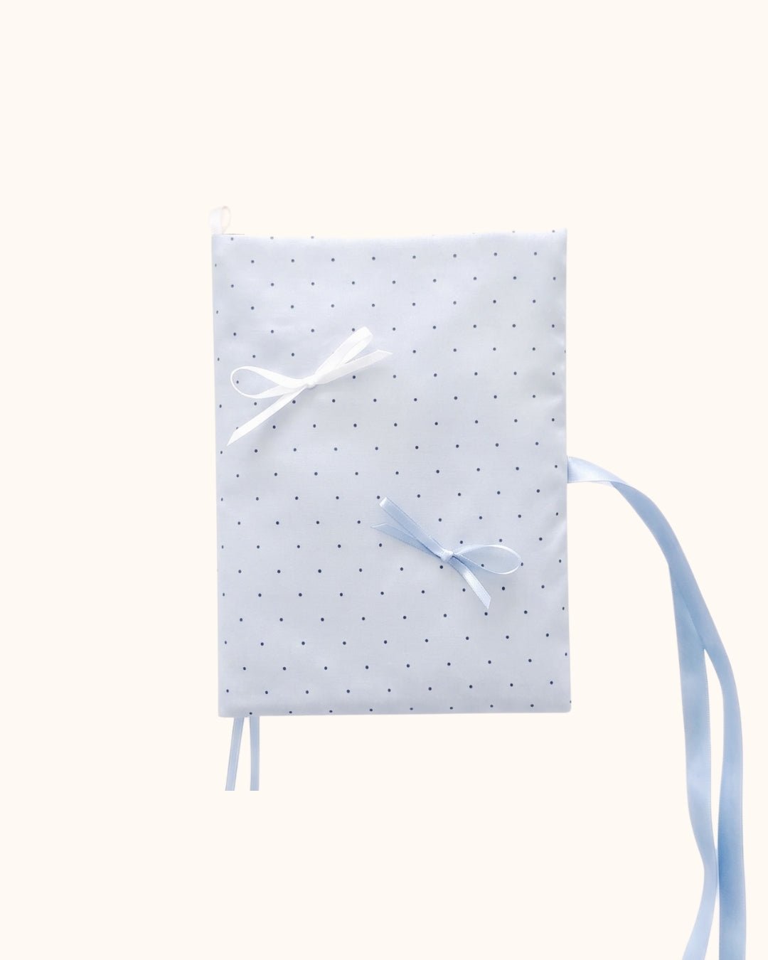 Kuura Reverie A5 & A6 Journal & Notebook Cover in Misty Blue Polka Dots, tiny dots with white and blue satin bows, front view. Soft girl stationery