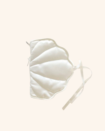 Kuura Shell A6 Journal & Notebook Cover in pearl white, a soft pillowy shell-shaped satin cover on a pale cream background. Romantic journal cover