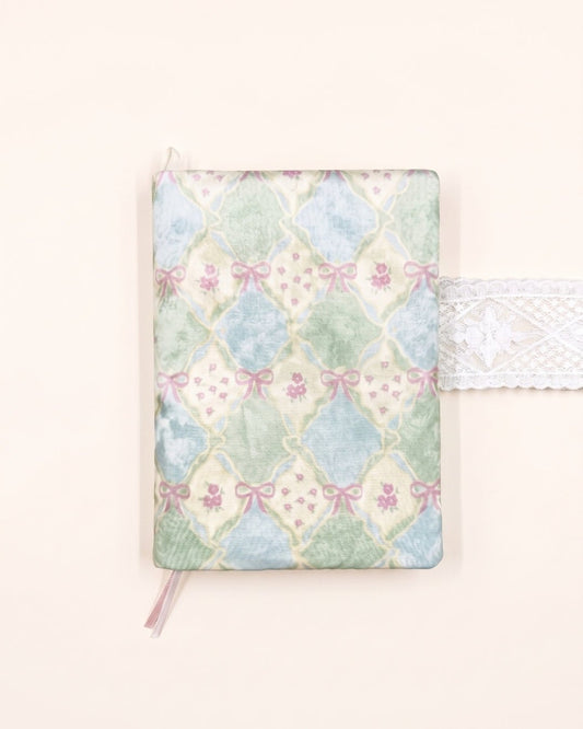 Kuura Sugar Trellis A5 & A6 Journal & Notebook Cover in Mint, pastel trellis print with pink bows and roses, front view on cream. Gift for journal lovers